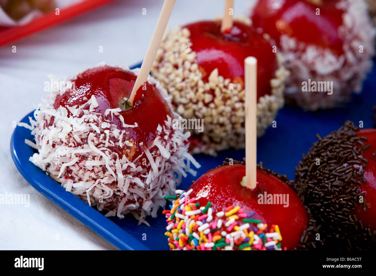 Several different flavors of candy apples at a country fair Stock Photo