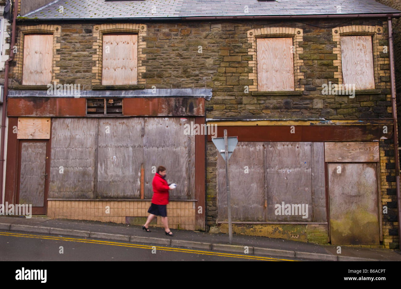 Closed and boarded up shops on hill in Abertillery Blaenau Gwent South