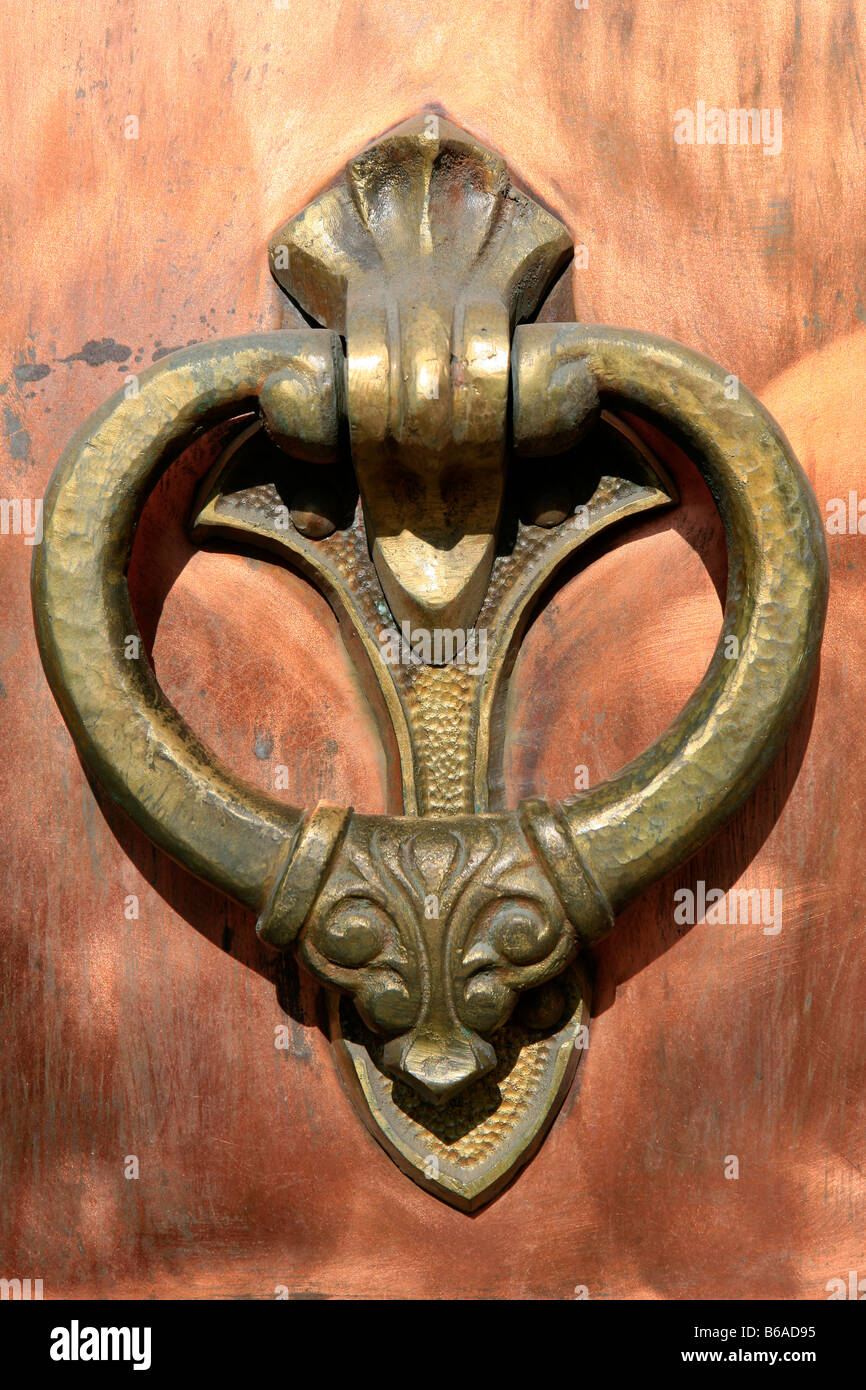 Closeup of the medieval copper door knocker of the 16th century