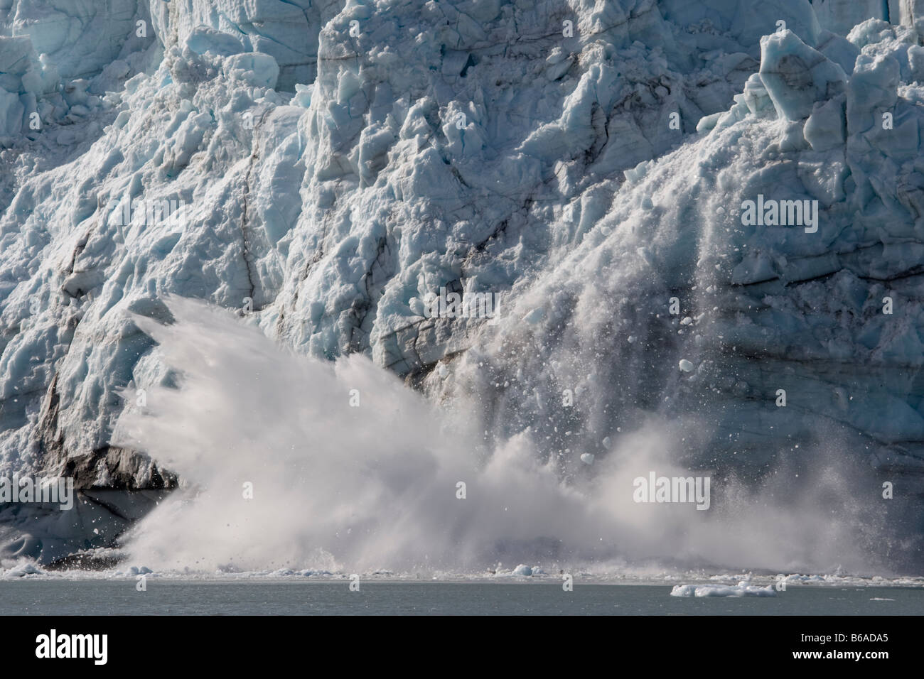 USA Alaska Glacier Bay National Park Icebergs calve with explosive splash from Margerie Glacier in Tarr Inlet on summer morning Stock Photo