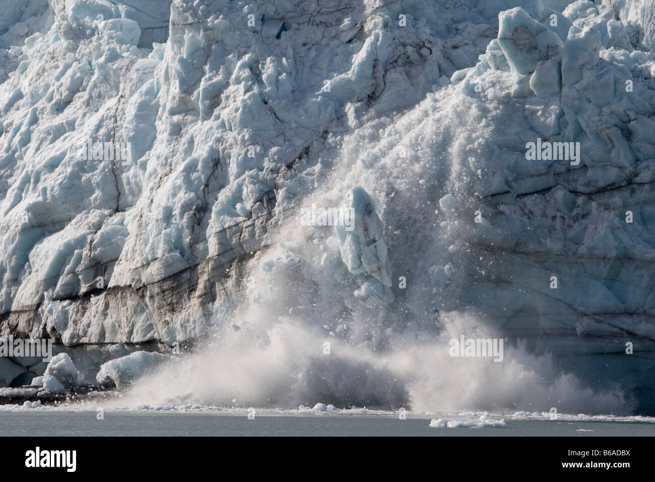 USA Alaska Glacier Bay National Park Icebergs calve with explosive splash from Margerie Glacier in Tarr Inlet on summer morning Stock Photo