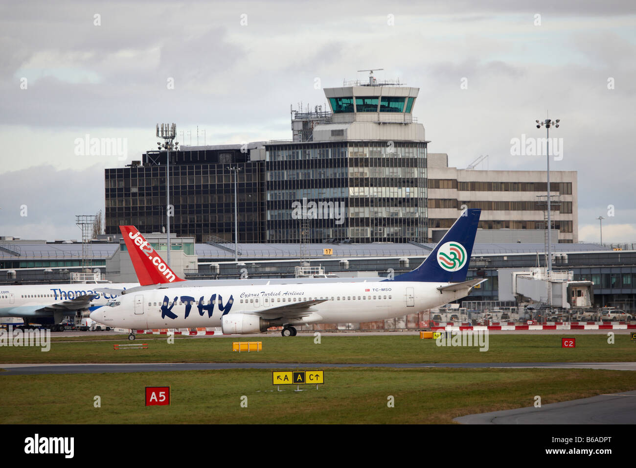 Passenger commercial airliner at manchester airport Stock Photo - Alamy