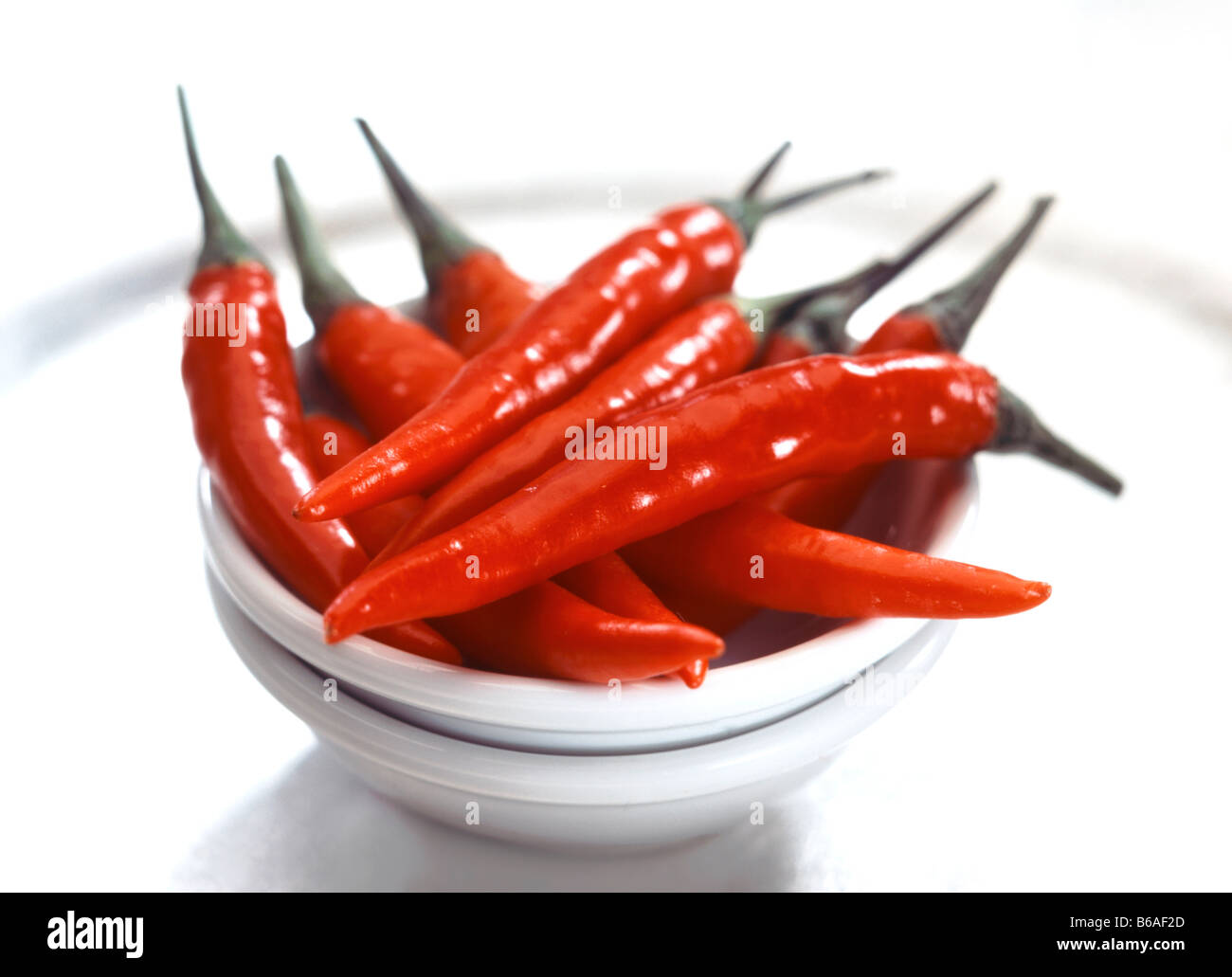 small red chillies in small bowls Stock Photo