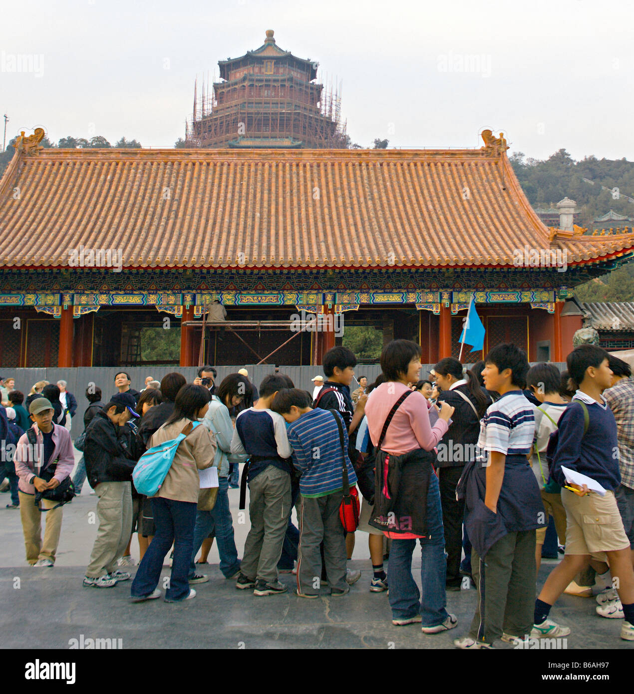 CHINA BEIJING Tour group of Chinese school children enters the Forbidden City also known as the Gugong or Imperial Palace Stock Photo