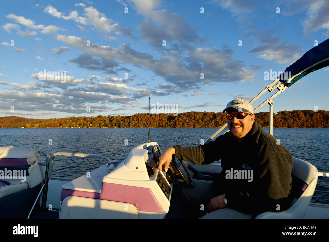 Man at the Helm of a Pontoon Boat on Watts Bar Lake in Rhea County