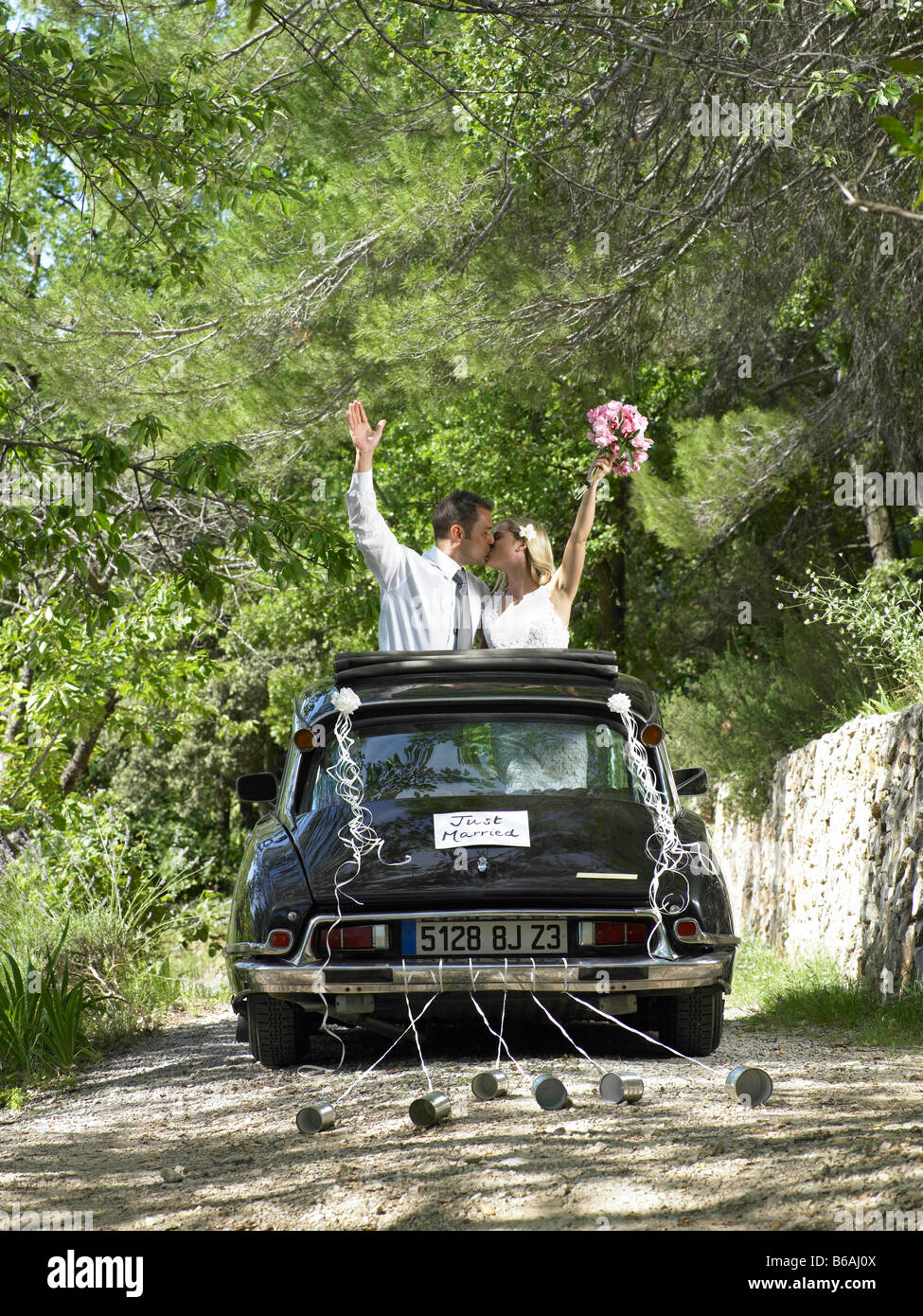 Bride and groom kissing in wedding car Stock Photo - Alamy