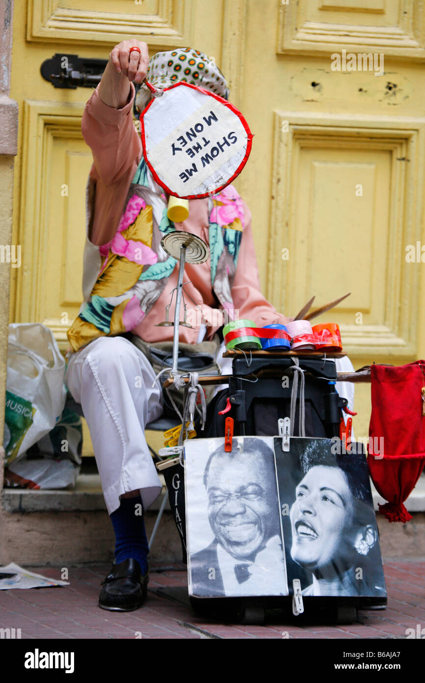 Eccentric street performer during the Sunday market in San Telmo, Buenos Aires Stock Photo
