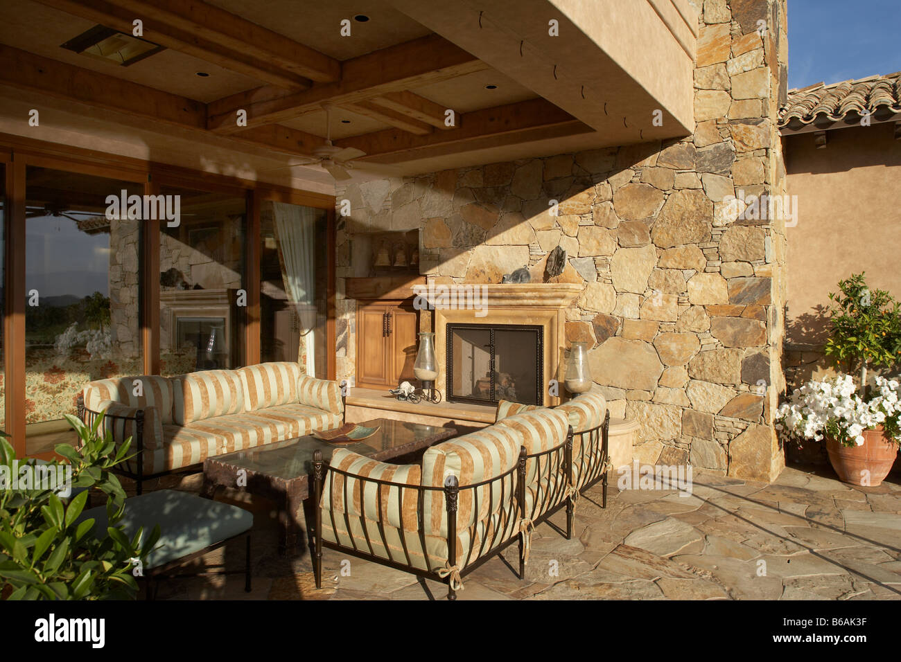 outdoor living room with fireplace Stock Photo - Alamy