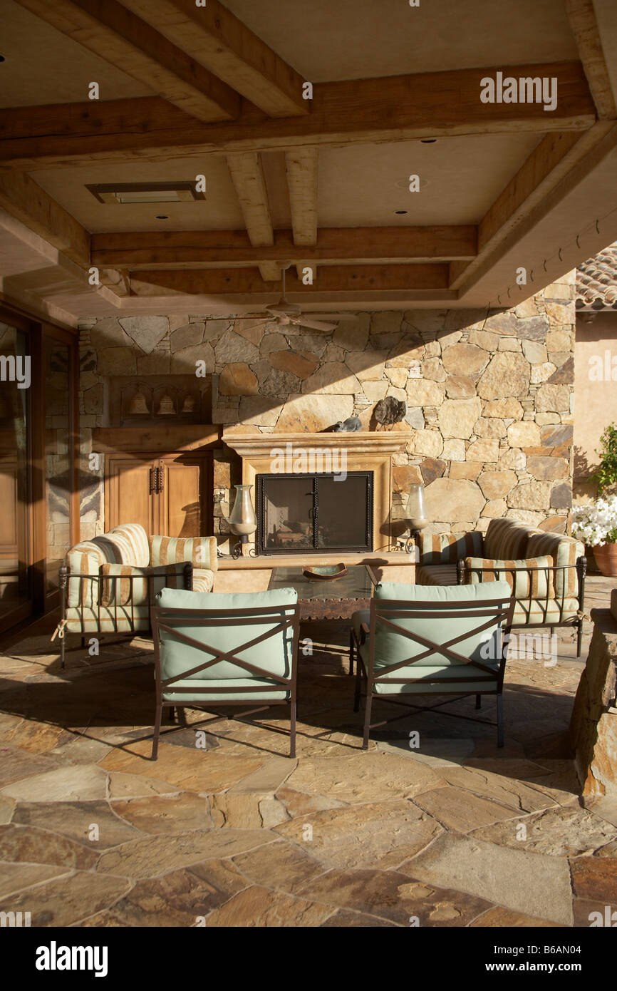 Outdoor living room with fireplace Stock Photo - Alamy