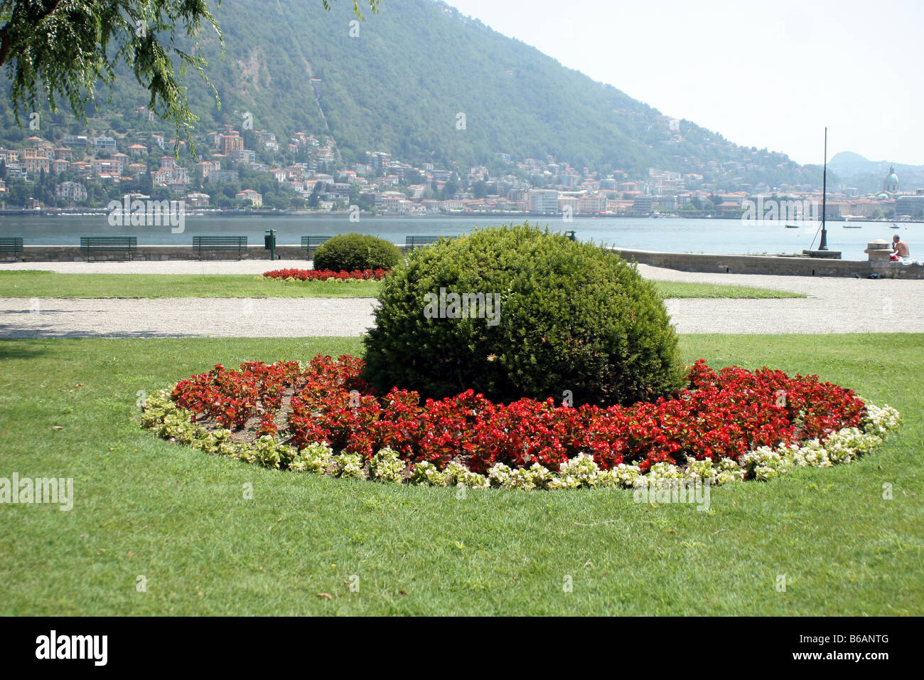 Circular flower bed at the side of Lake Como Italy Stock Photo