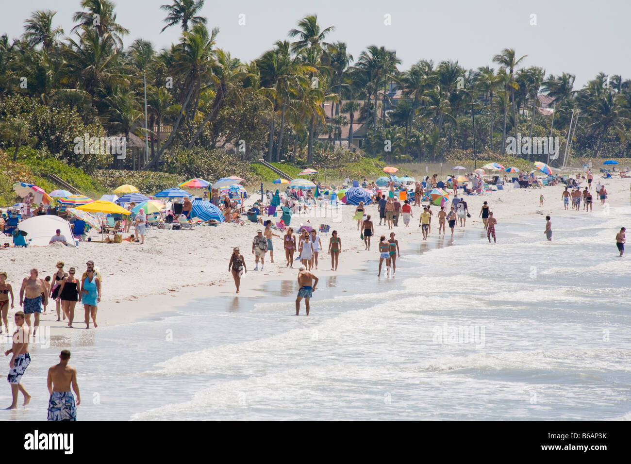Spring break and vacation crowds on Naples Beach on the southwest Gulf