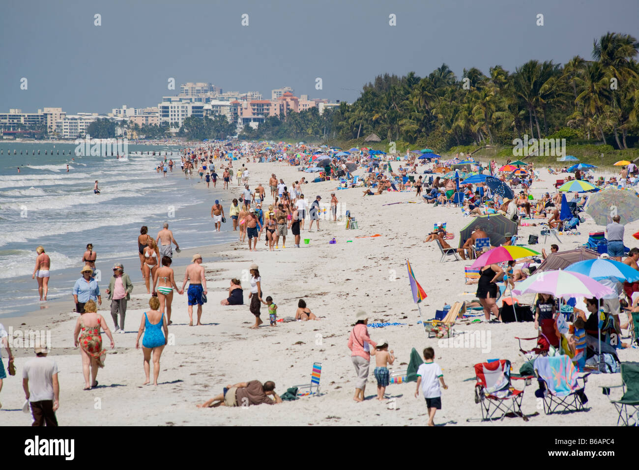 Spring break and vacation crowds on Naples Beach on the southwest Gulf