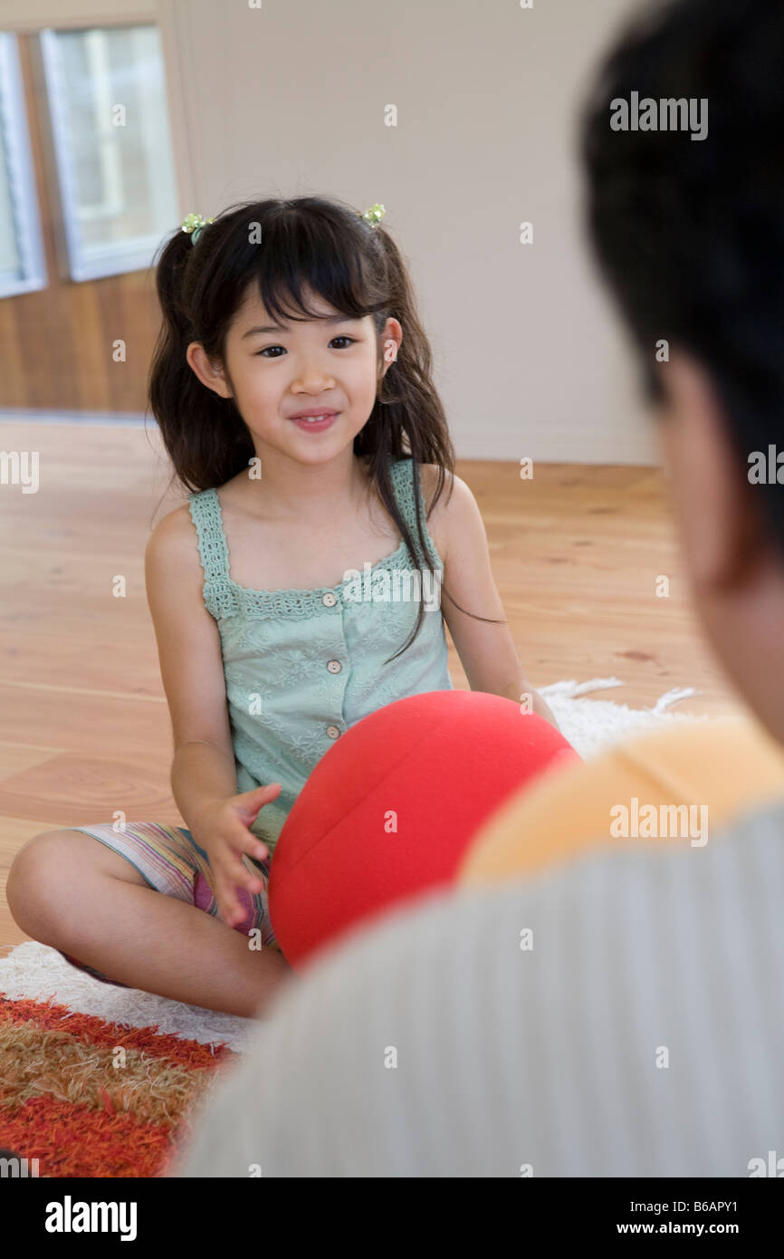 Girl holding cushion Stock Photo Alamy