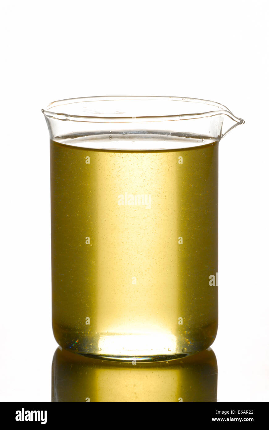 A BEAKER FILLED WITH COCONUT OIL Stock Photo