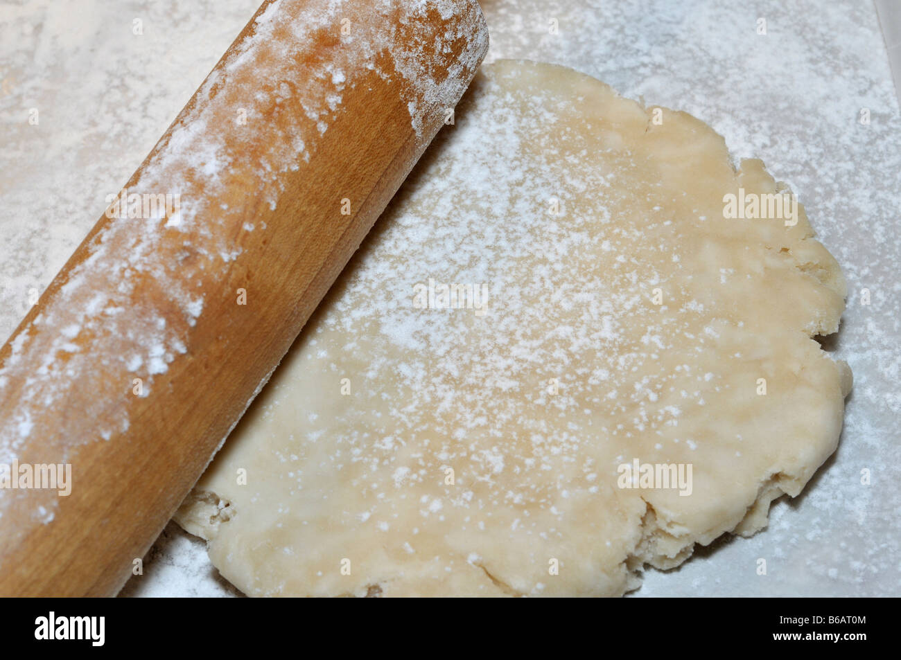 Rolling out pie shell with wooden rolling pin. USA Stock Photo Alamy