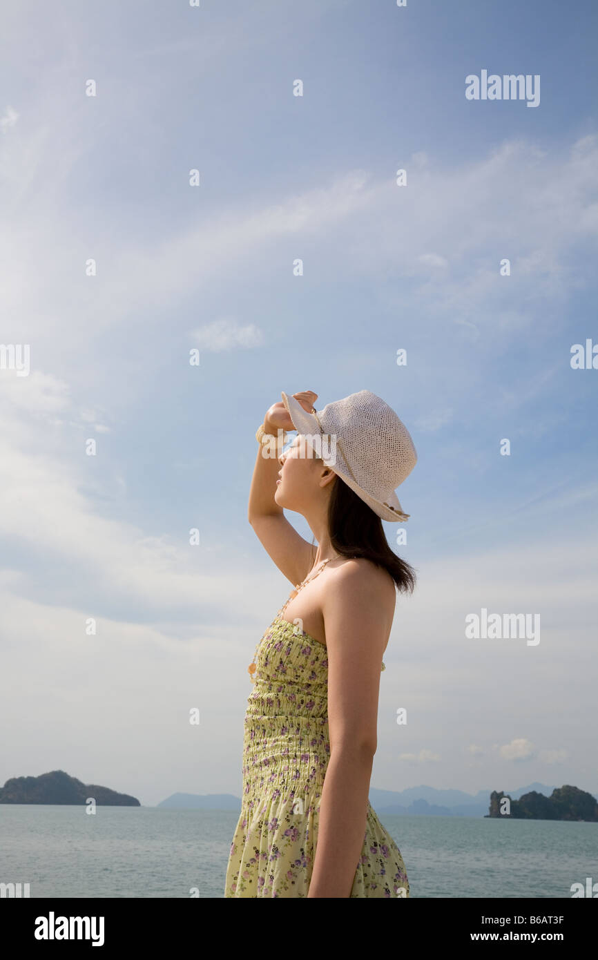 Woman standing wearing hat hi-res stock photography and images - Alamy