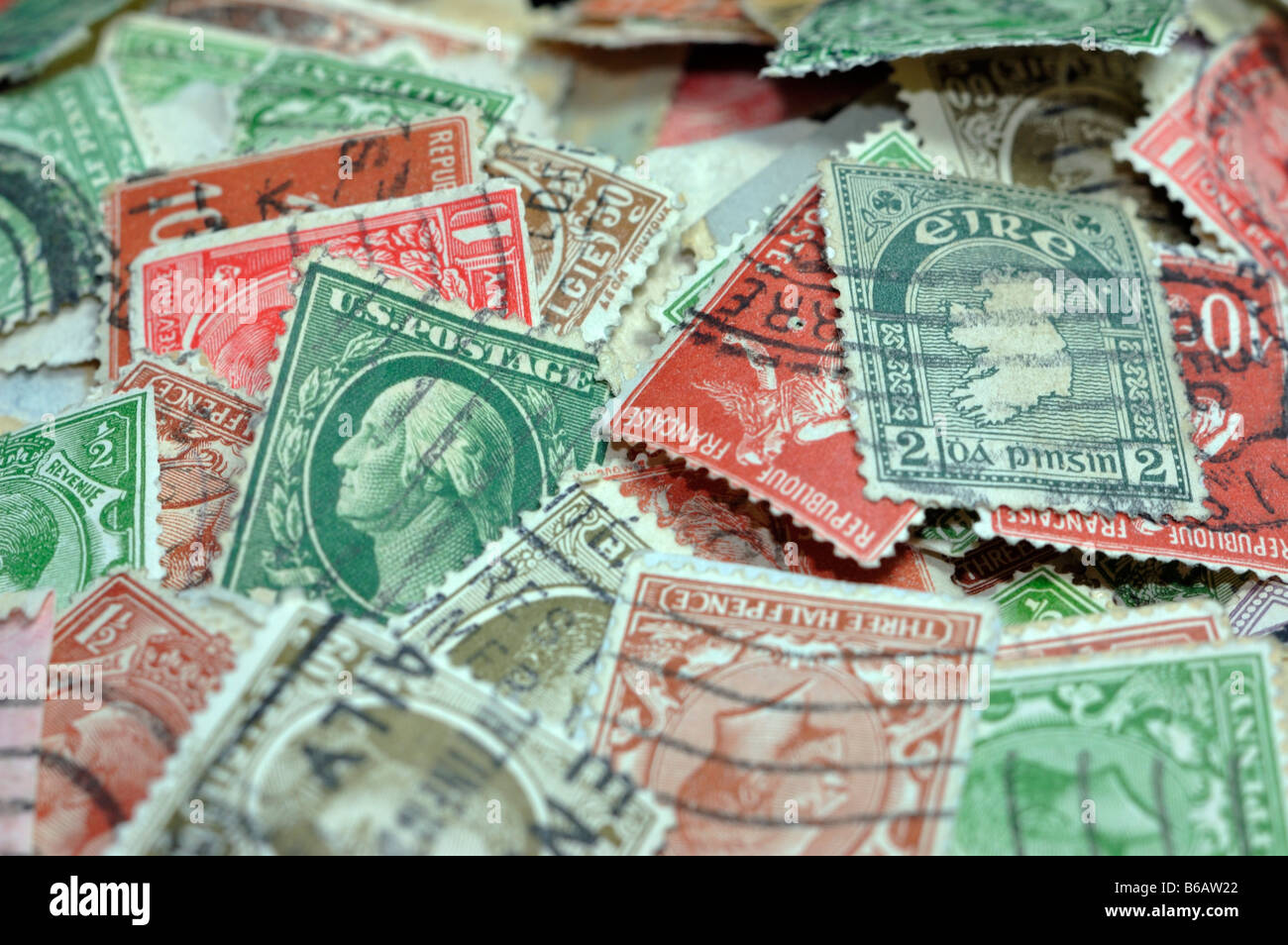 Closeup of a collection of canceled international postage stamps Stock