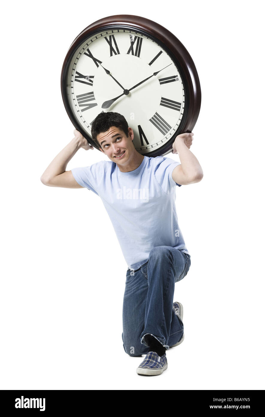 young man with a clock Stock Photo - Alamy