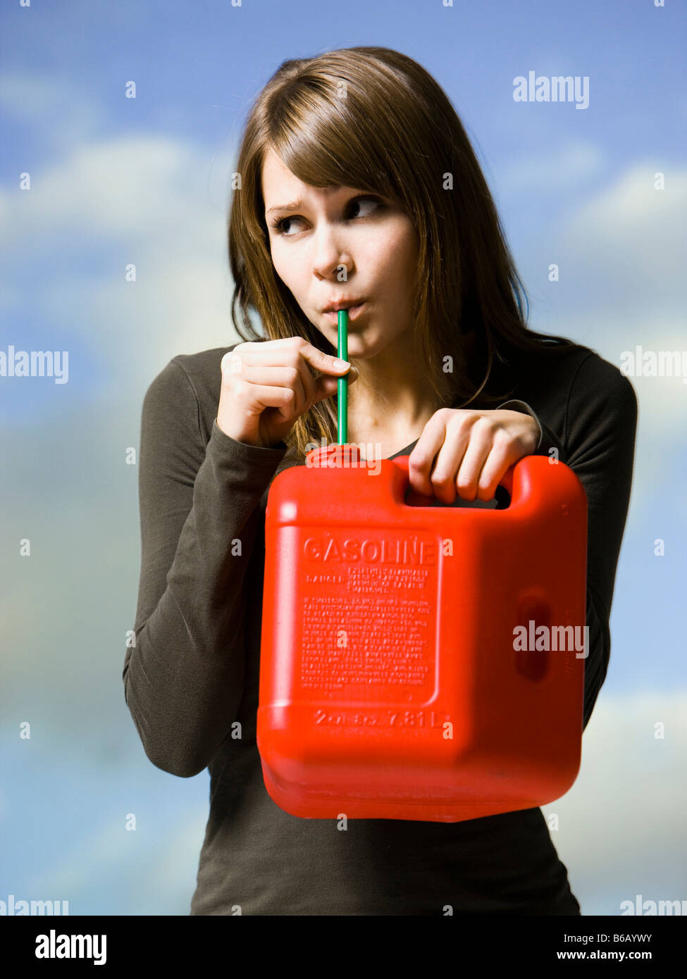 woman drinking gasoline Stock Photo