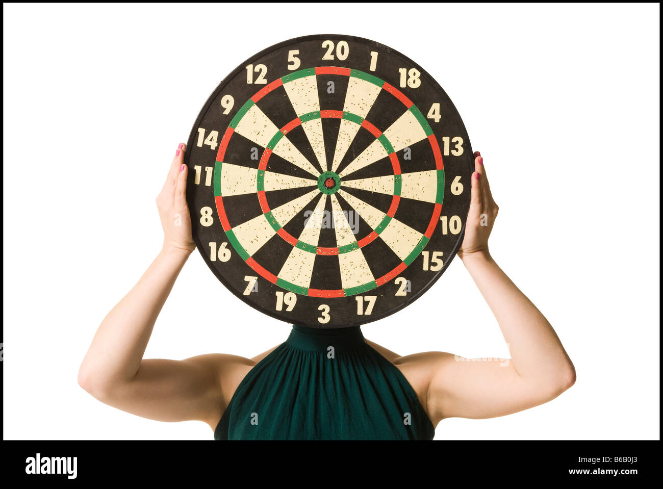 woman with dartboard covering head Stock Photo