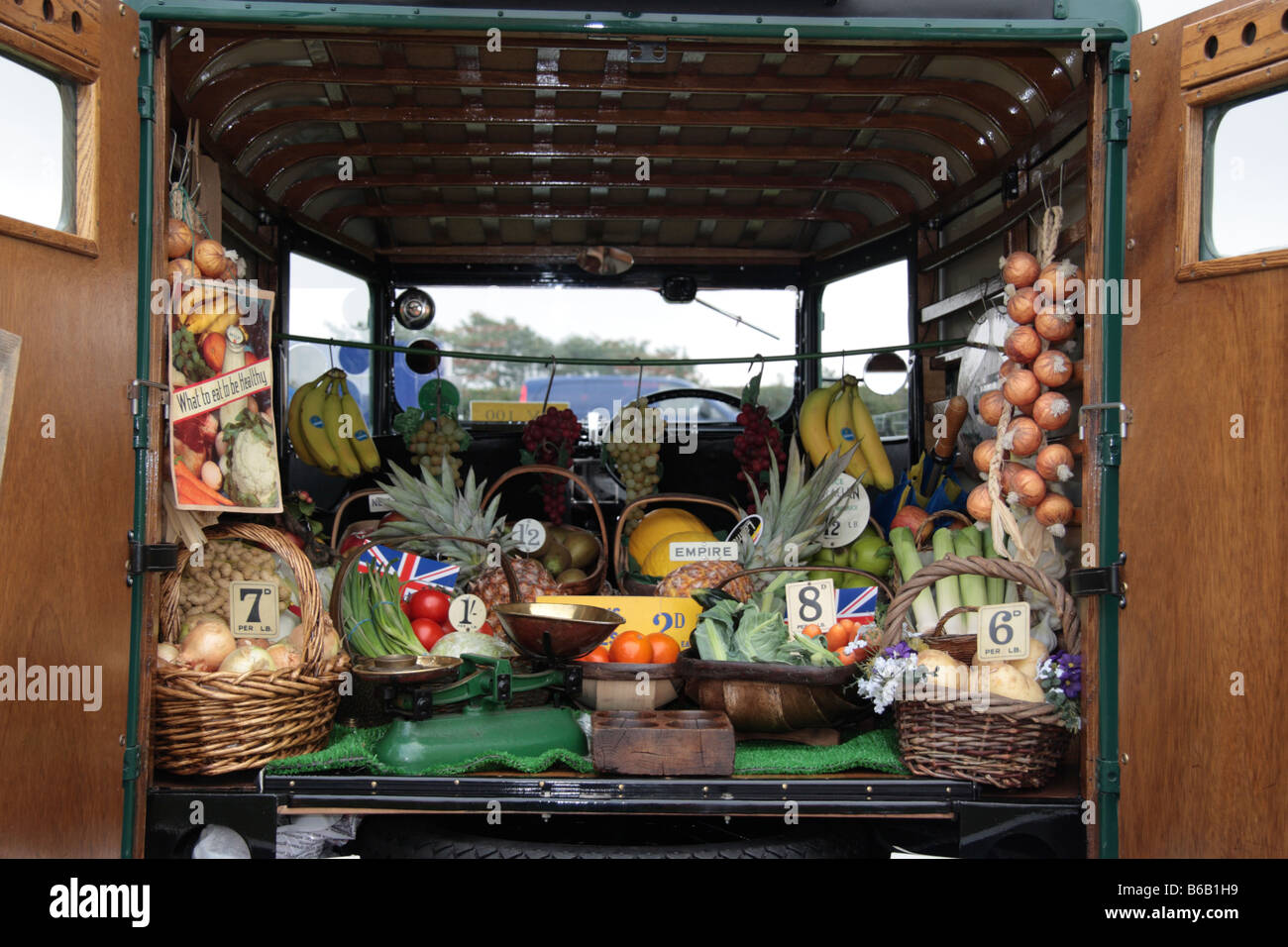 Display of Fruit and vegatables in back of travelling grocers van showing pre decimal prices Stock Photo