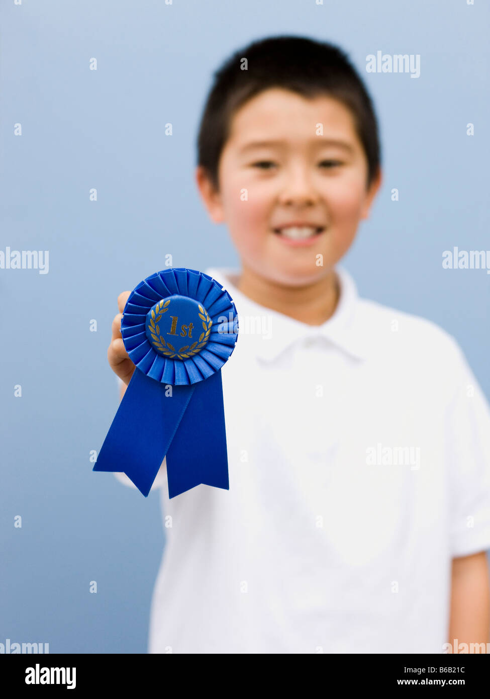 boy with a blue ribbon Stock Photo Alamy