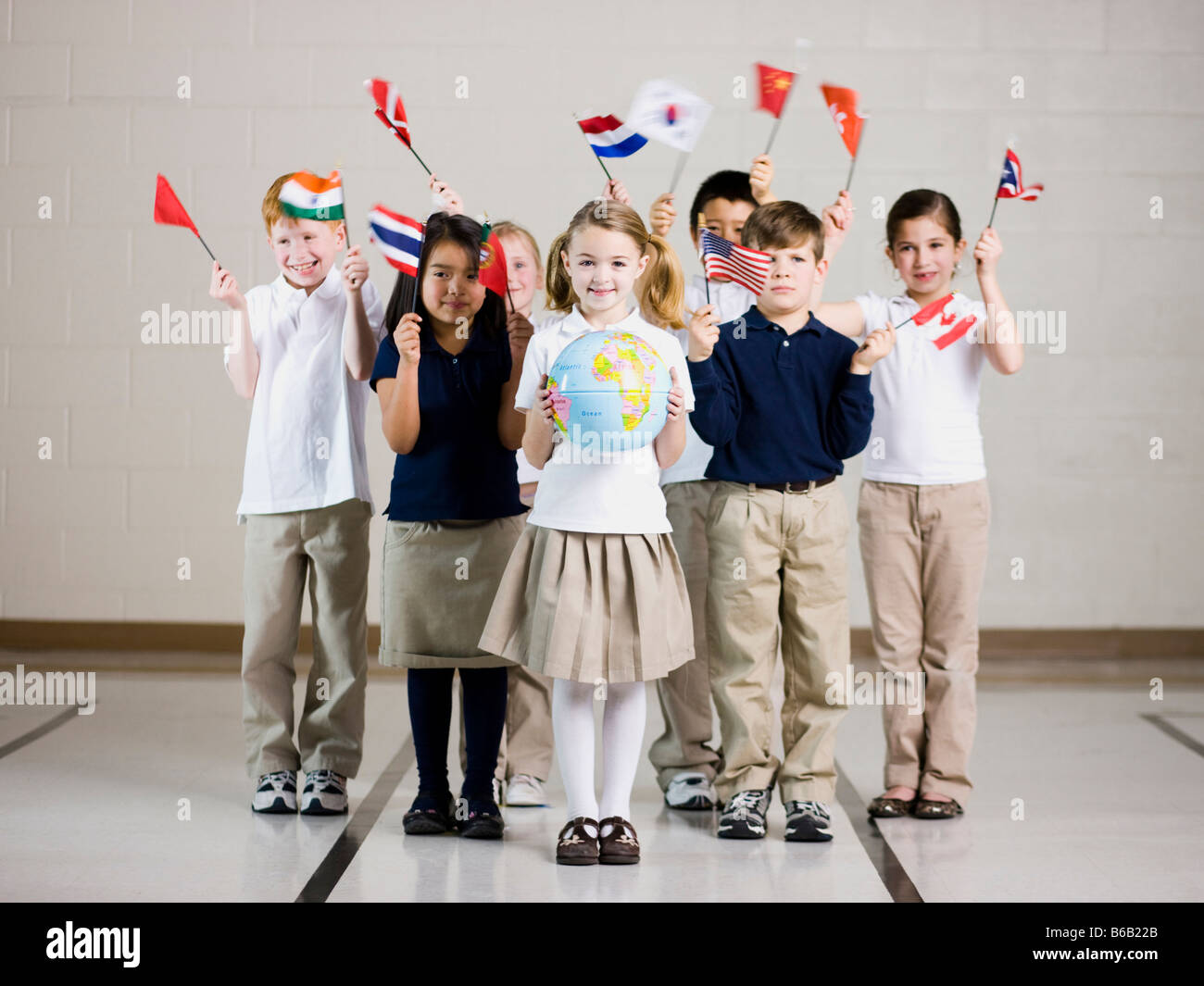 school children waving flags of different countries Stock Photo Alamy