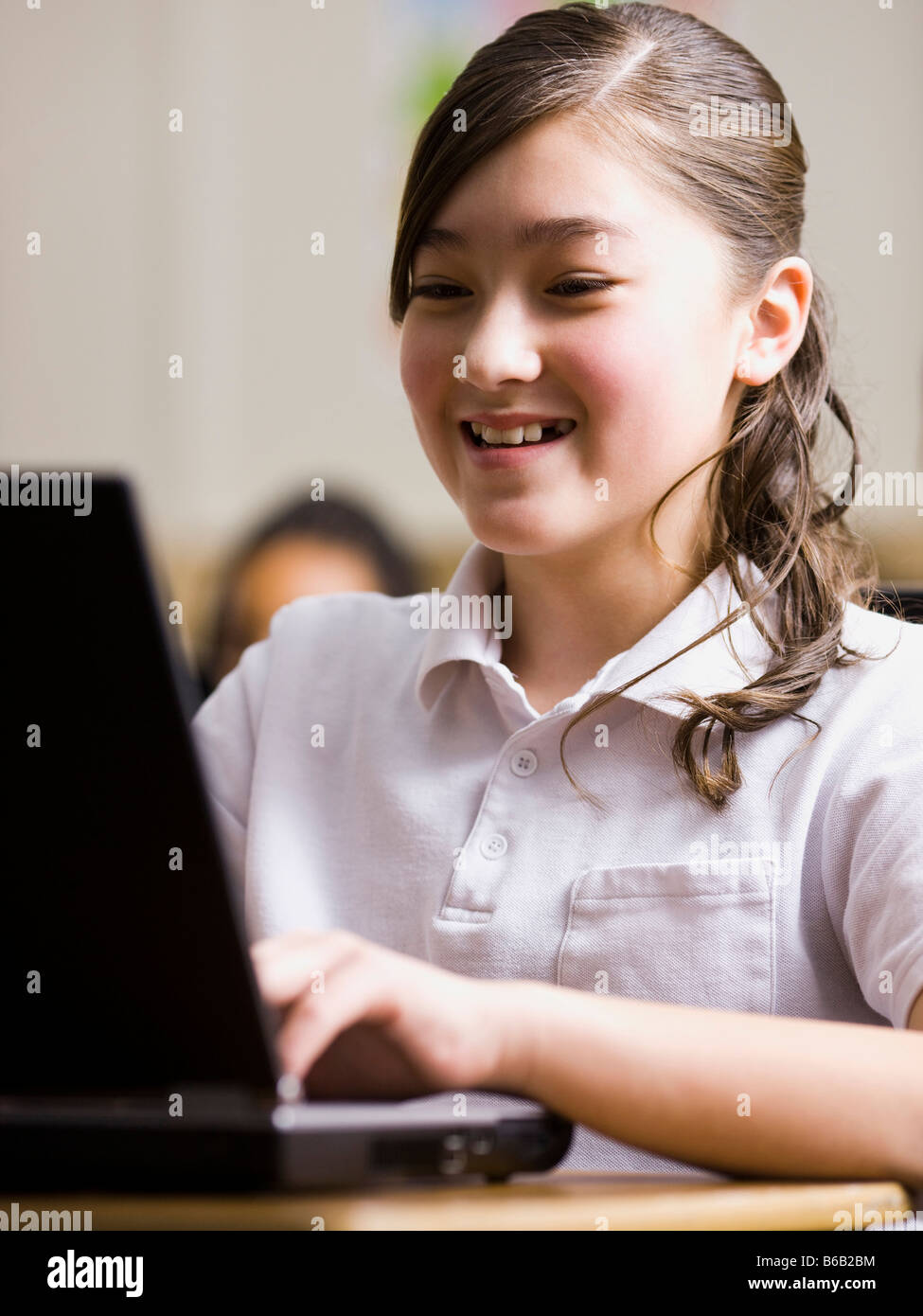 girl with laptop in classroom Stock Photo - Alamy
