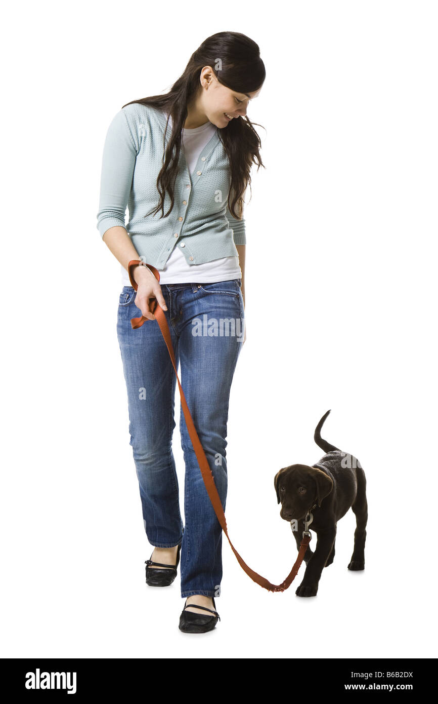 woman walking dog Stock Photo