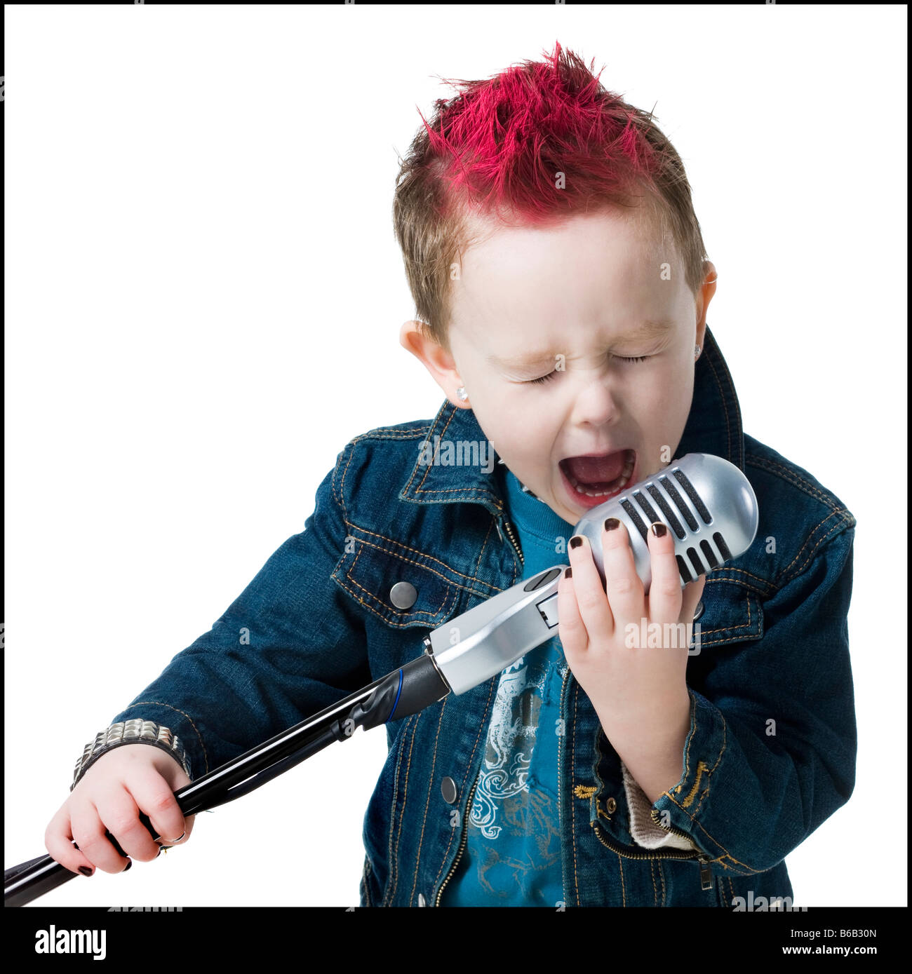 little boy singing into a microphone Stock Photo Alamy