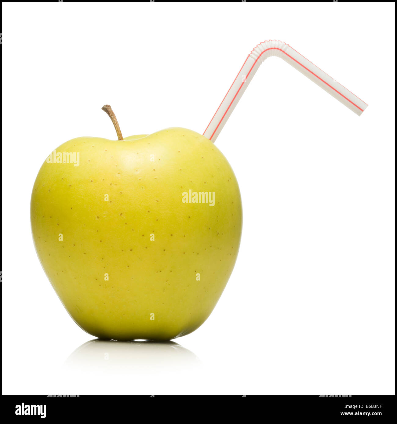 apple with a straw in it Stock Photo