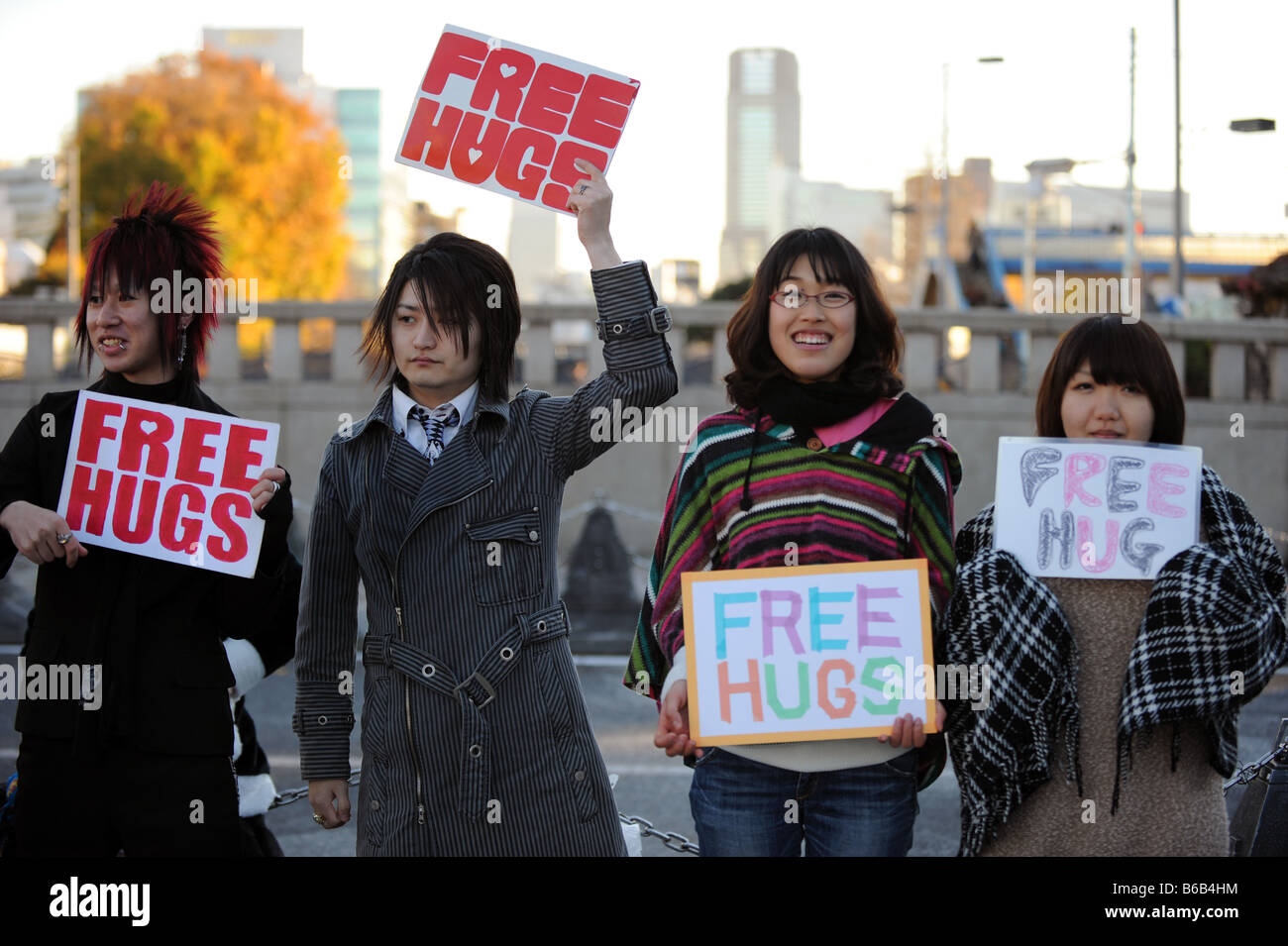 A group of Japanese teenagers offering Free Hugs to passers by in