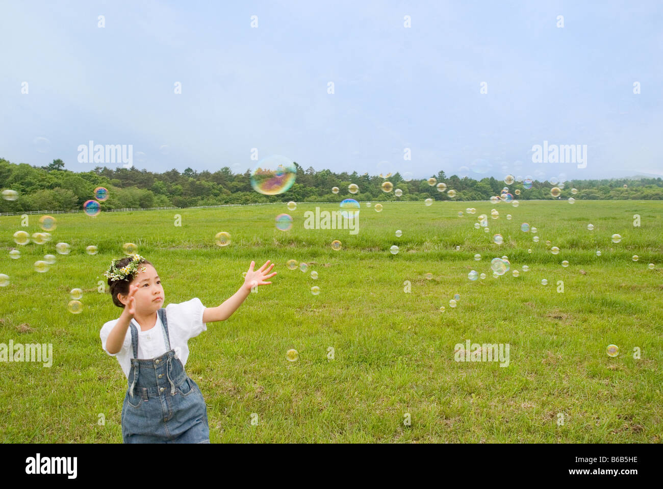 girl-trying-to-catch-bubble-stock-photo-alamy