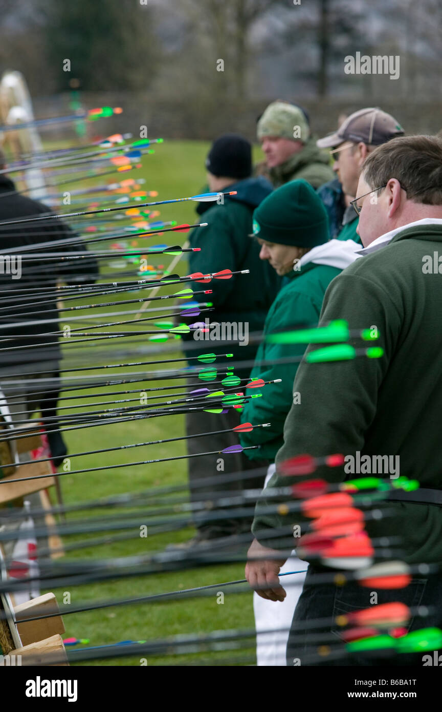 Archers evaluating scores on target bosses Stock Photo