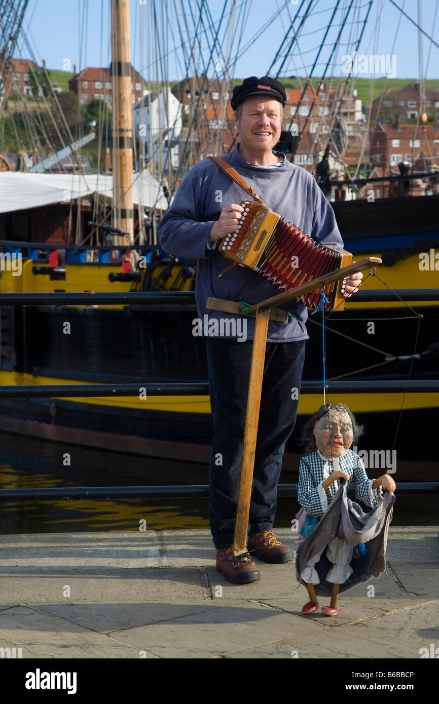 Man playing Castagnari Melodeons on resort Seafront, Whitby Town North Yorkshire. UK Stock Photo