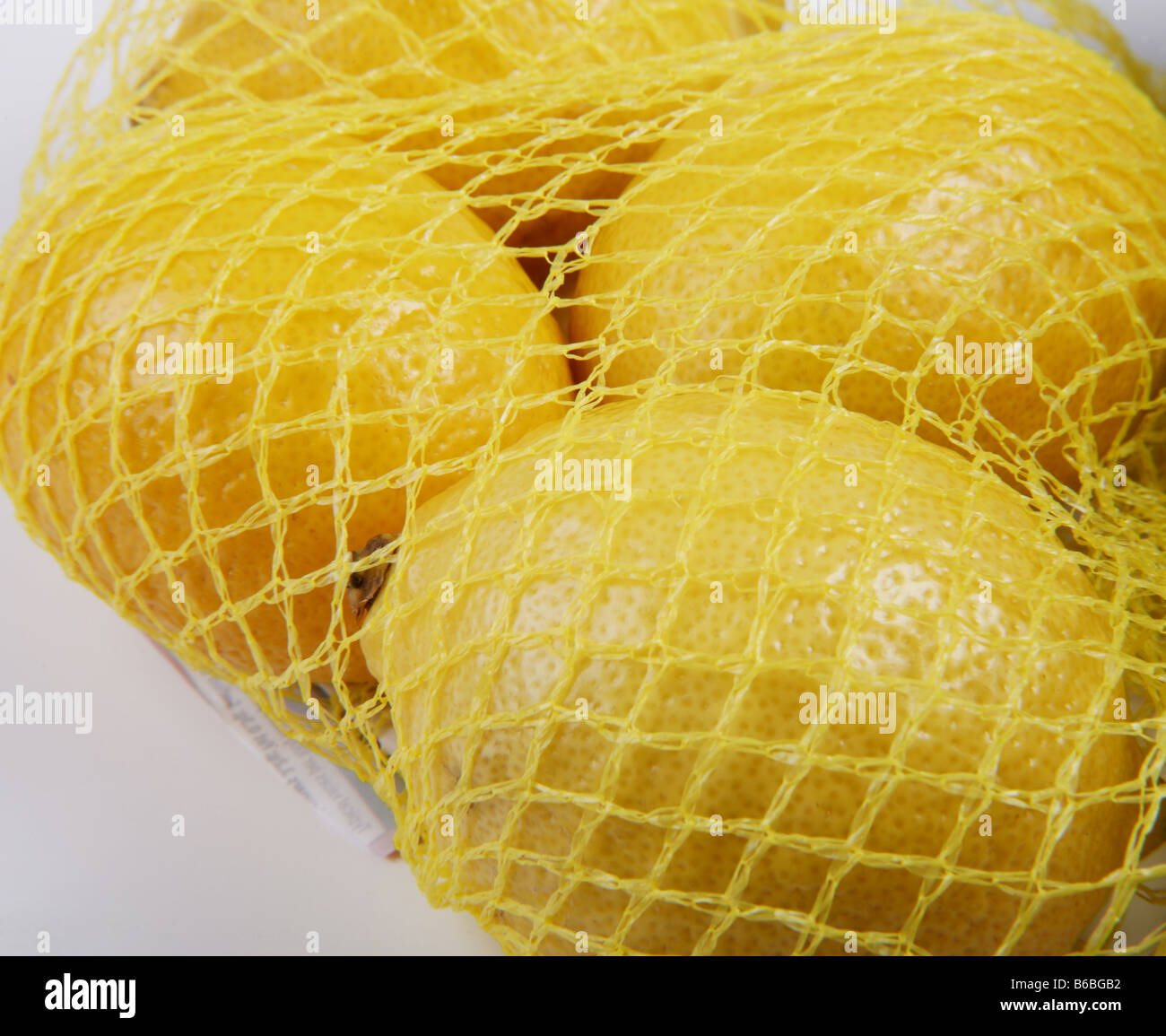Net of Supermarket Bought Lemons Stock Photo