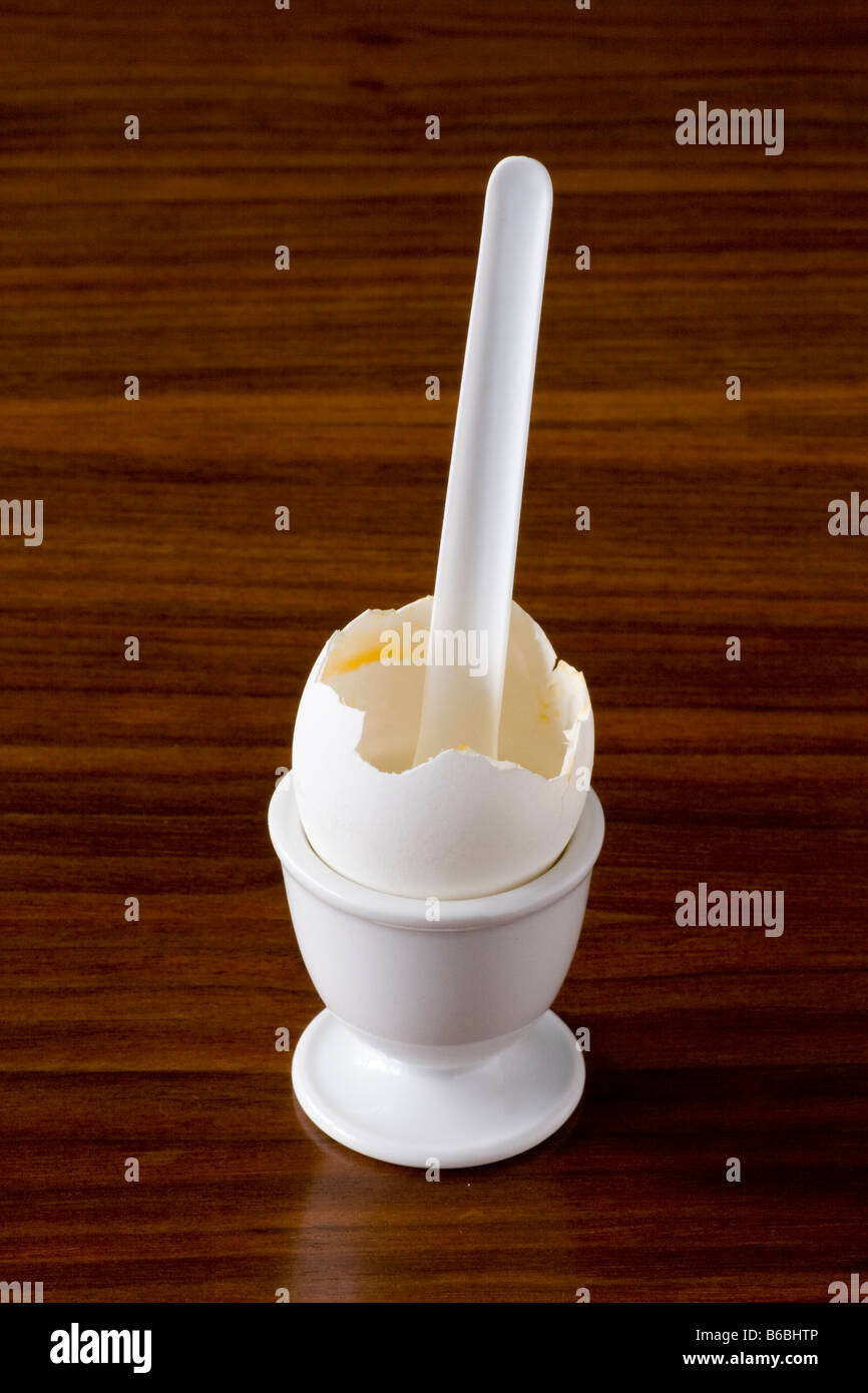 Close-up of broken egg in eggcup Stock Photo