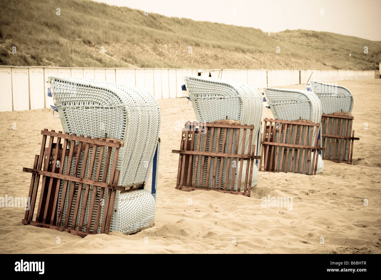 Wicker beach chairs on beach Stock Photo Alamy
