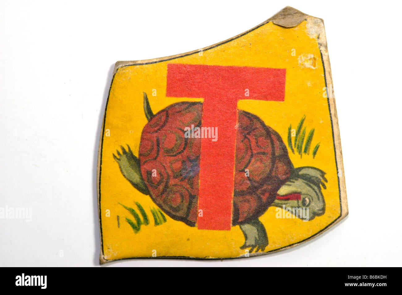 Vintage alphabet letter puzzle piece for children with the letter T and
