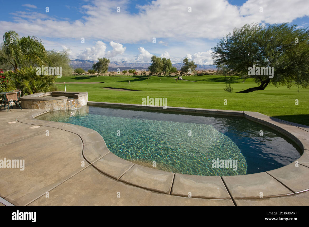 Swimming Pool on Golf Course, Mission Hills, Palm Springs, CA Stock Photo