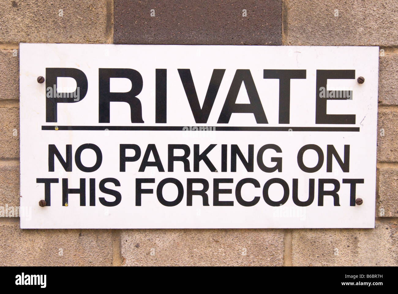 Private no parking on this forecourt sign in uk car park Stock Photo