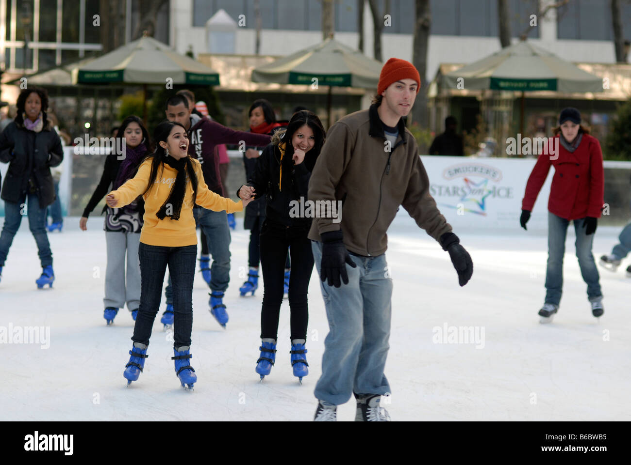 Skaters maneuver the packed Pond at Bryant Park ice skating rink in New York Stock Photo