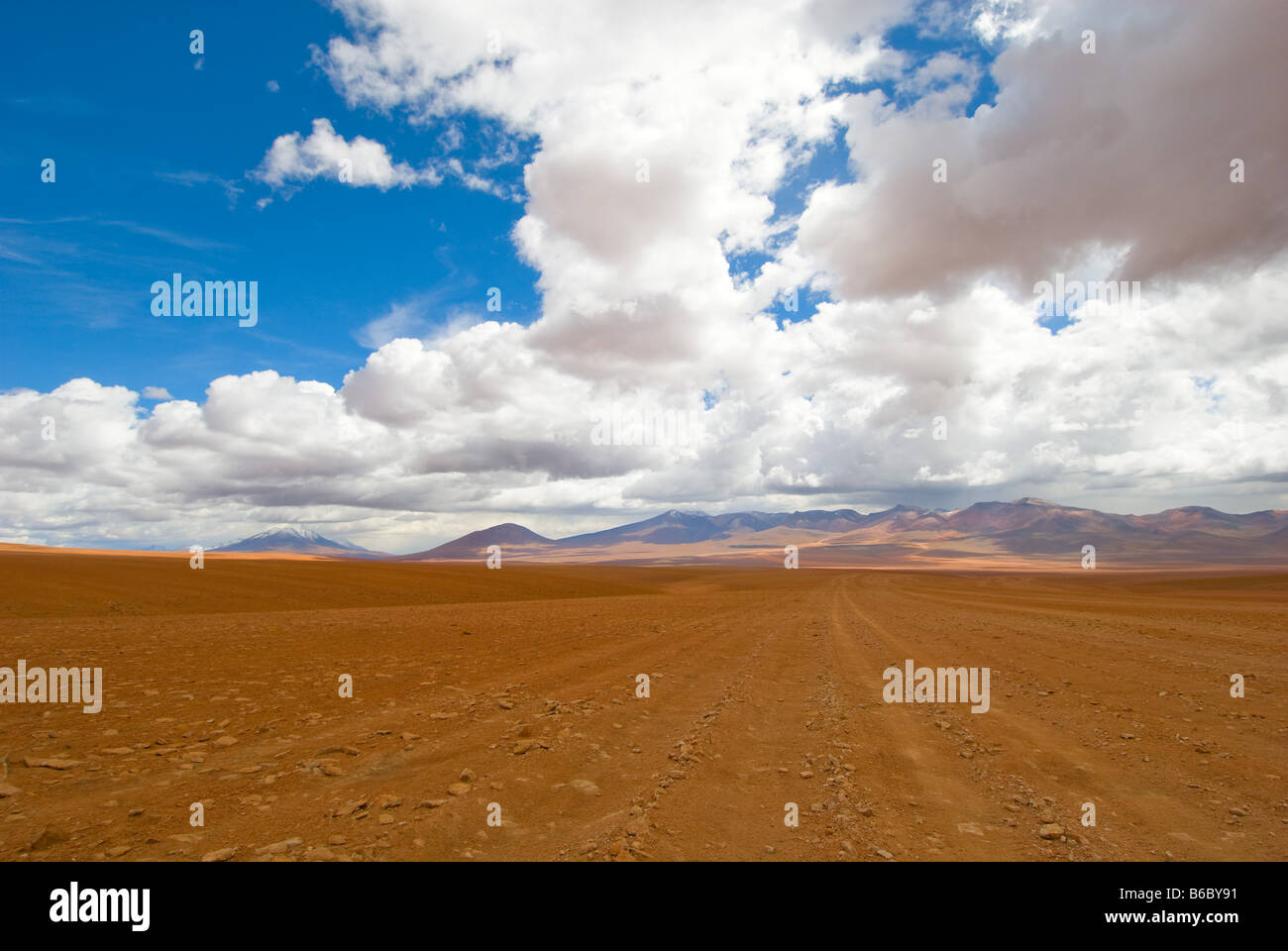 desert road white clouds and deep blue sky Stock Photo - Alamy