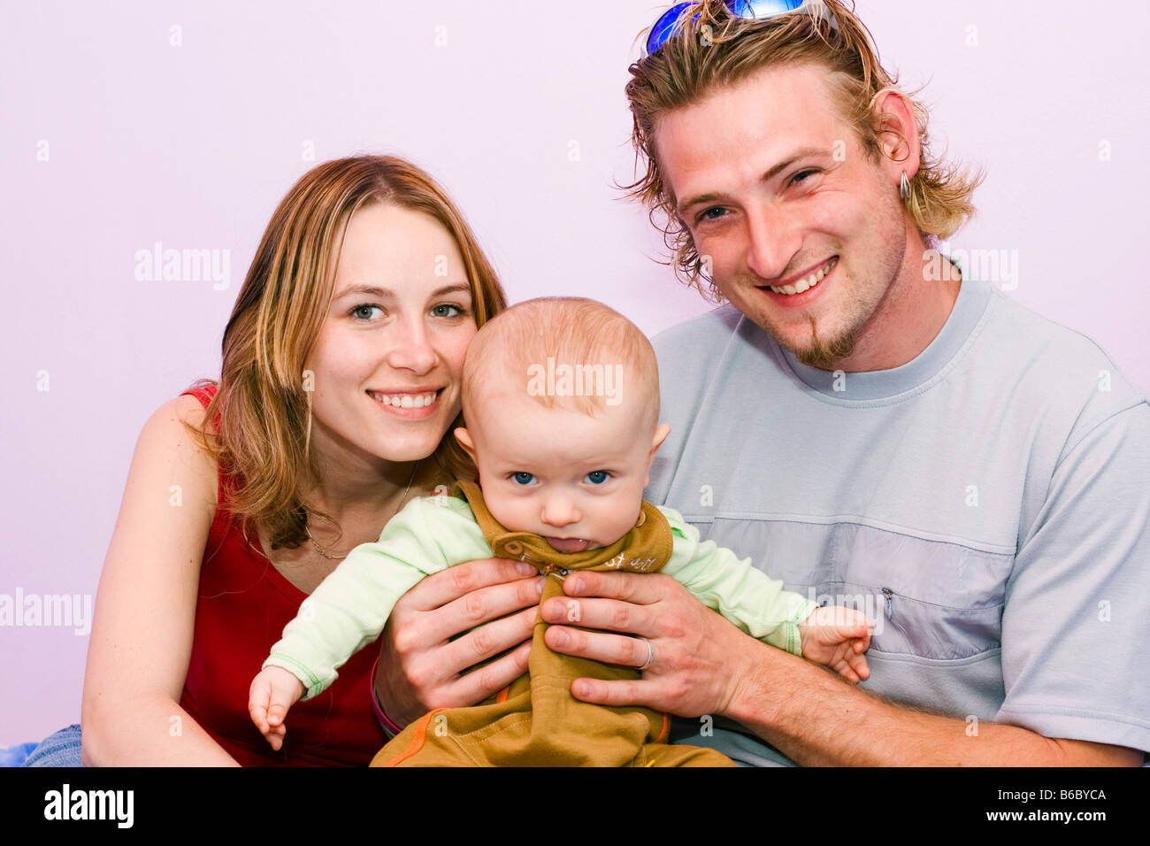 Happy young family mother 25 years father 25 years and son 7 months Stock Photo