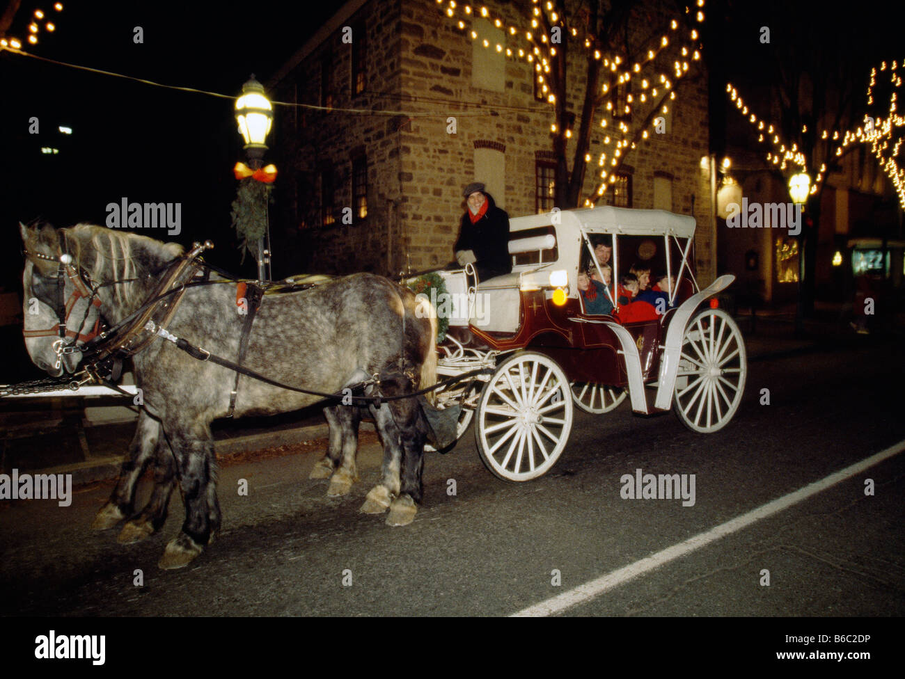 Horse drawn carriage gives visitors dusk tours of historic downtown