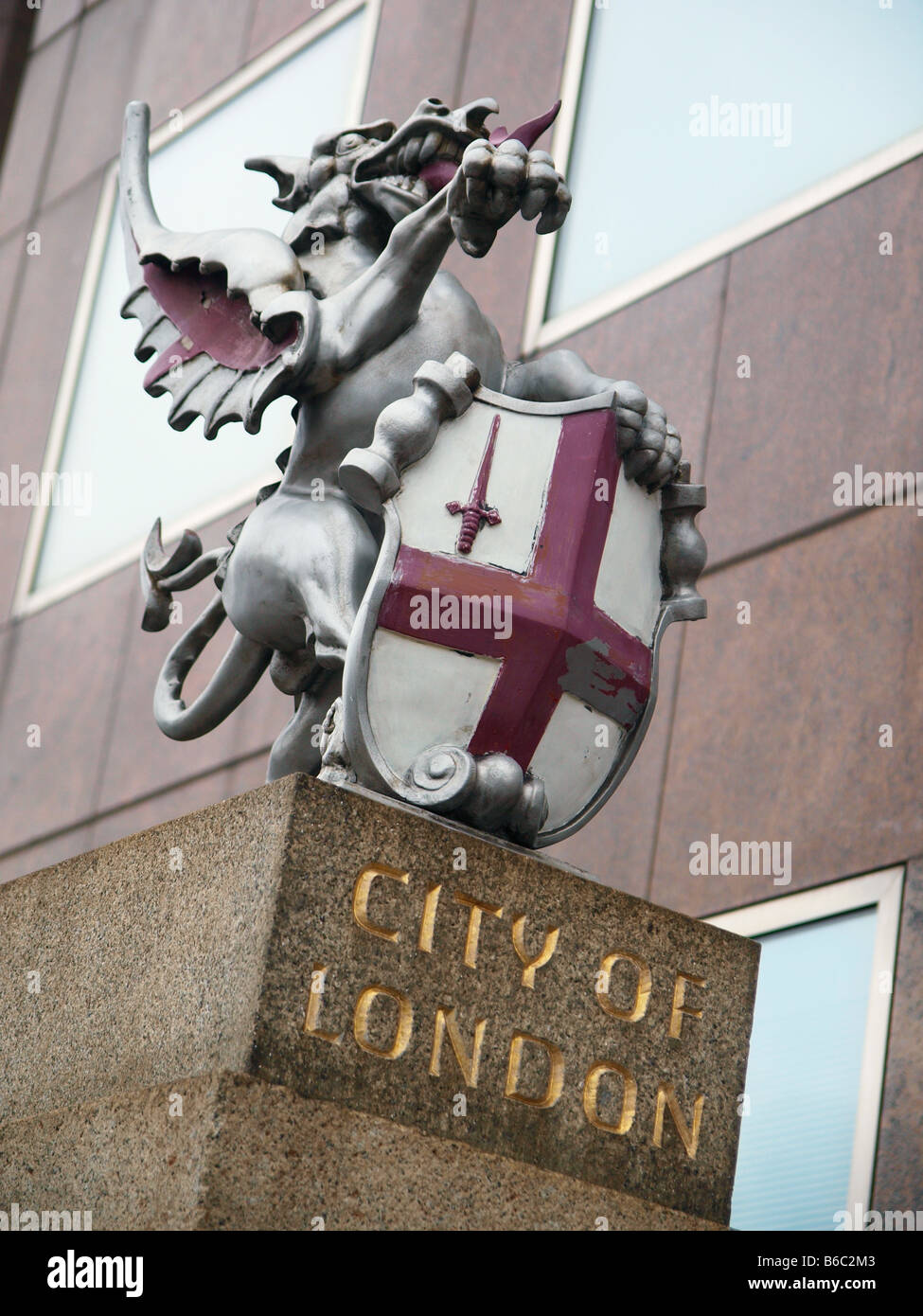 City of London winged dragon with shield with red cross on white background Stock Photo