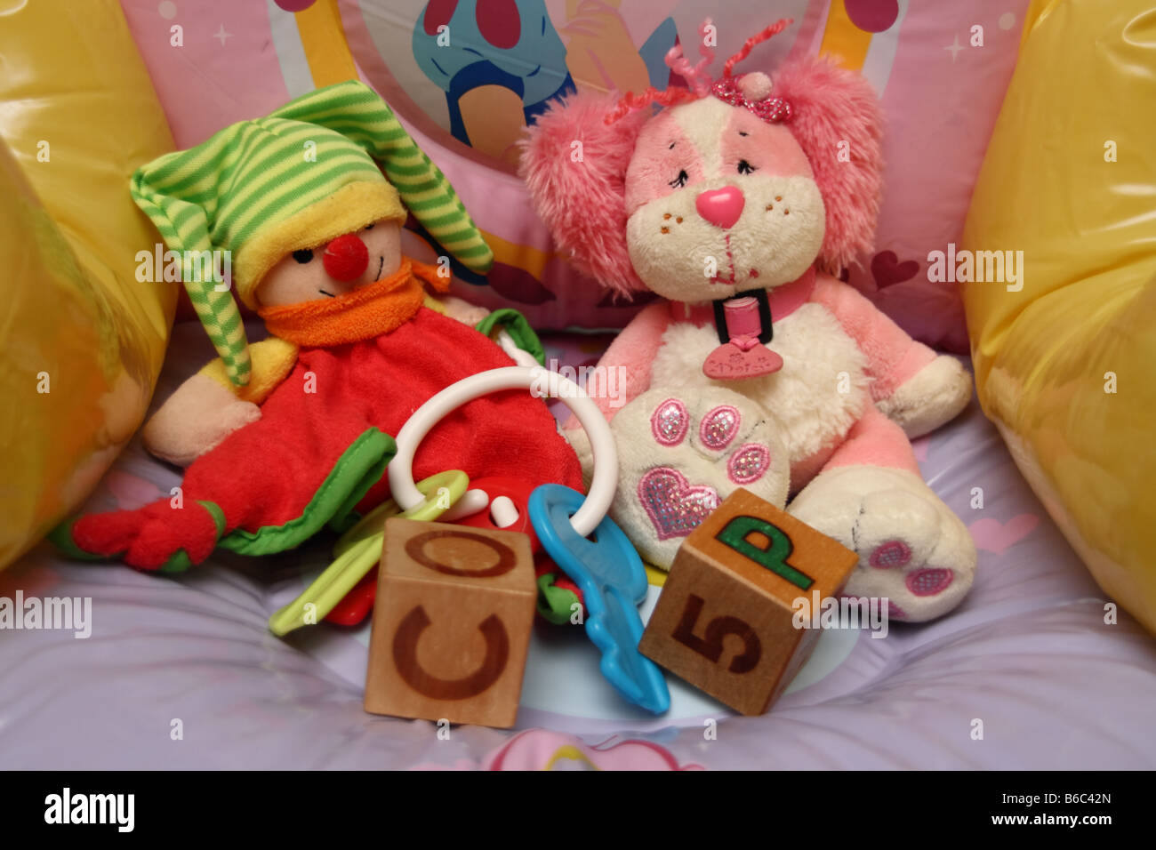 Children's toys arranged on a inflatable chair Stock Photo
