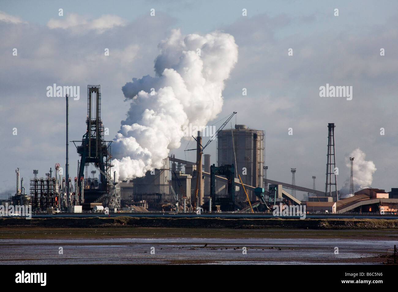 British Steel Industry Plant industrial site Coke Ovens. Steelworks emitting steam plume at Middlesbrough, Redcar, Teesside, North Yorkshire UK Stock Photo