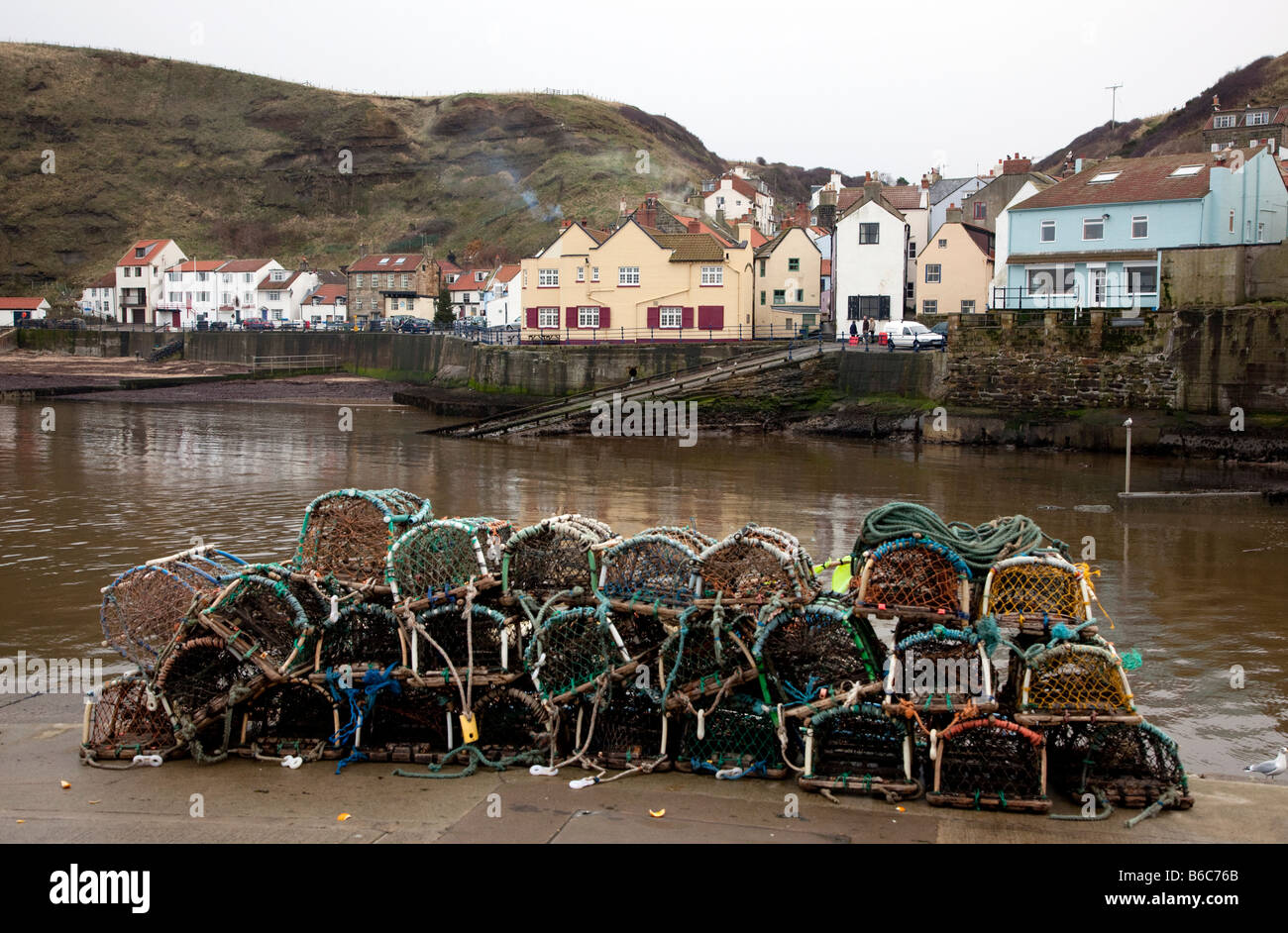 Lobster pots on the harbour in the North Yorkshire village of Staithes England UK Stock Photo