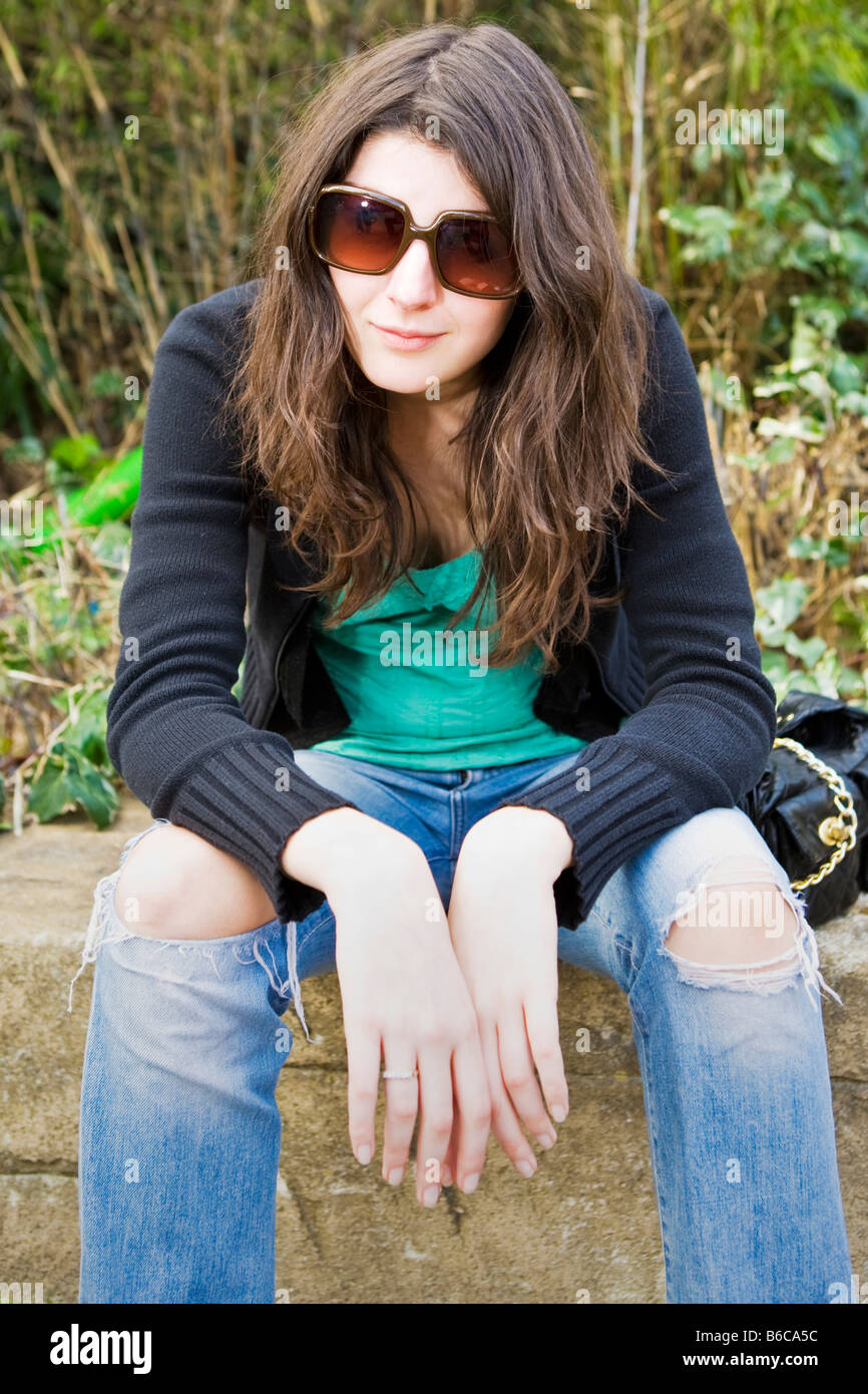 Portrait of a young woman sitting down Stock Photo